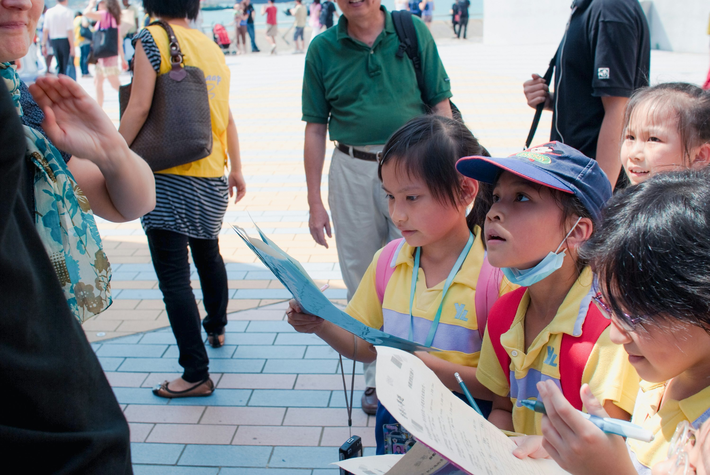 Teacher supervising pupils on an educational visit