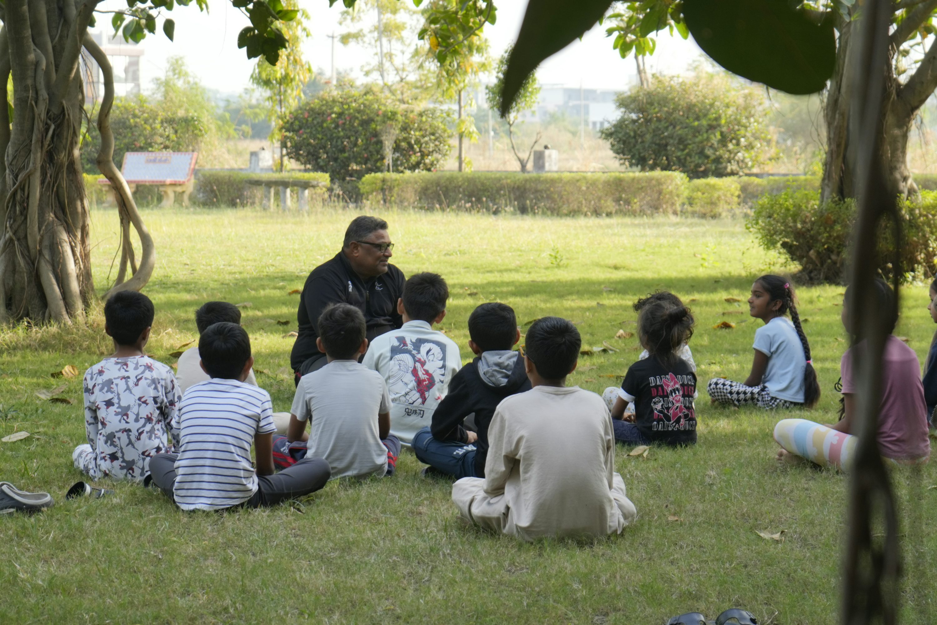 Teacher leading pupils in outdoor learning