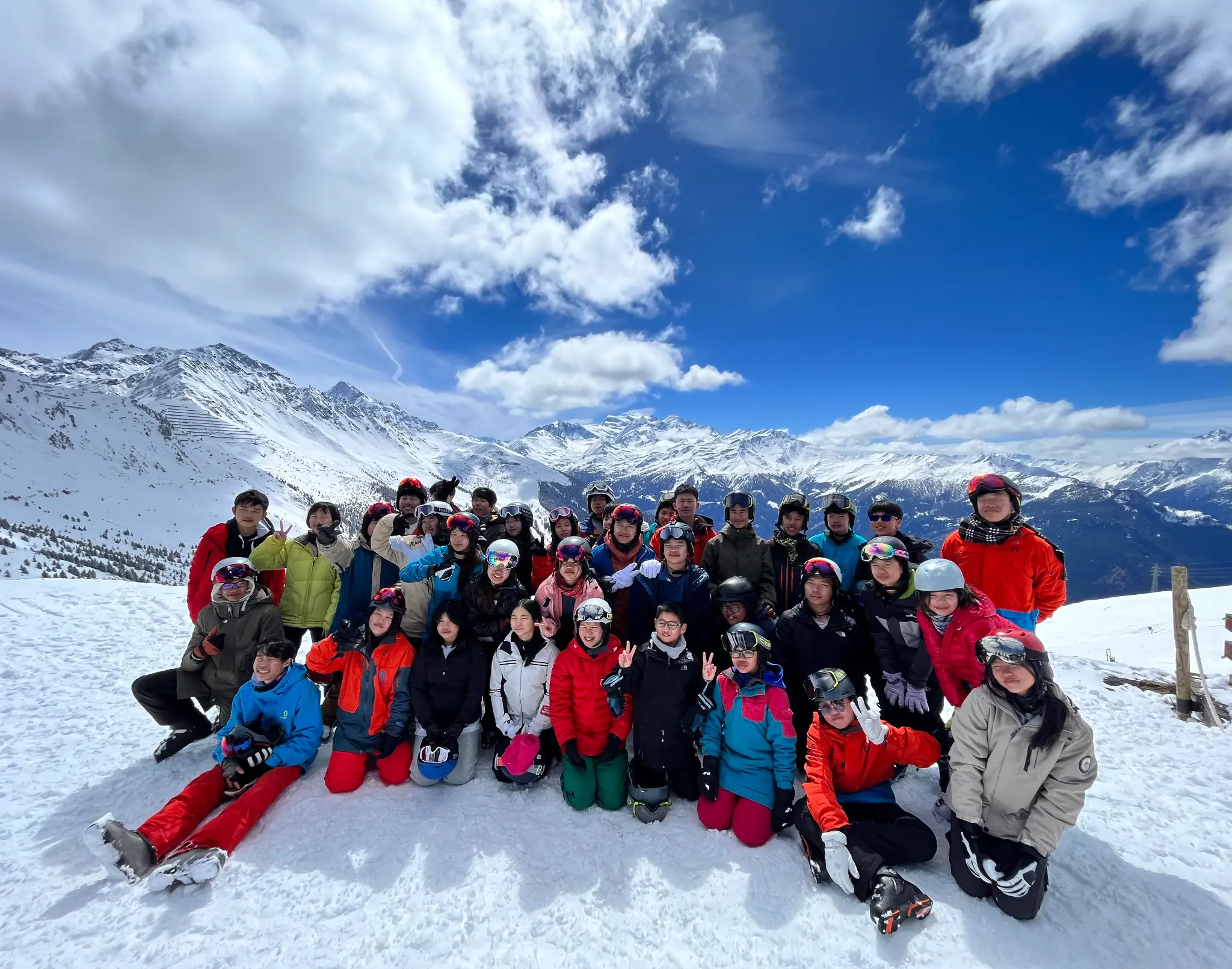 School group on a supervised ski trip in an alpine setting